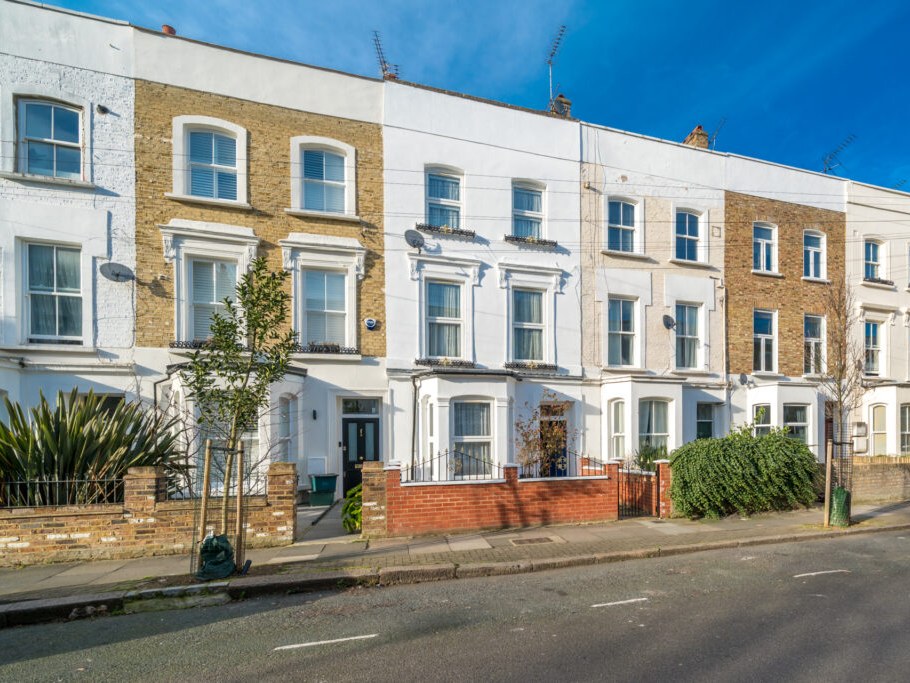 Row of period terraced houses in white and yellow brick, London